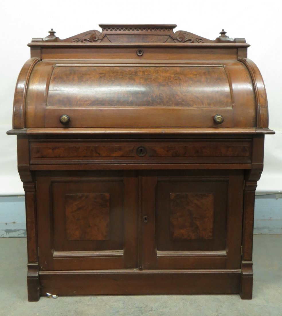 Victorian black walnut cylinder desk with burl walnut p: Victorian black walnut cylinder desk with burl walnut panels on front, and backsplash. Cylinder desk with fitted interior with drawers over 1 long drawer over 2 doors, also with fitted interior - 40"L