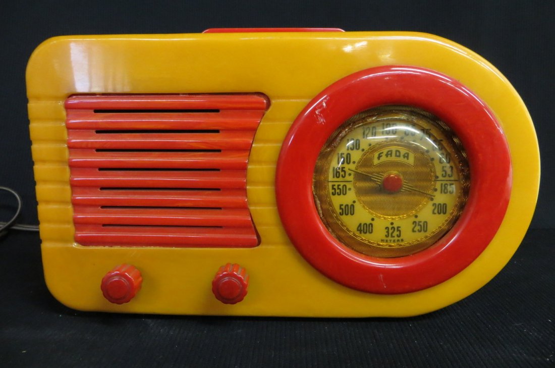 Catalin Fada "bullet" radio in butterscotch and red col: Catalin Fada "bullet" radio in butterscotch and red color. Model 1000. Radio has a butterscotch colored body and contains red handle, red knobs, red dial bezel and red speaker grill. All in excellent 