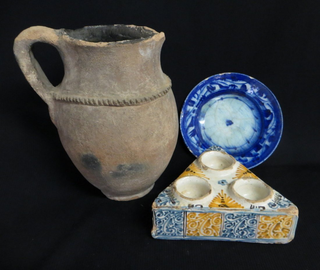 Three early pottery items including Spanish Faience tri: Three early pottery items including Spanish Faience triangular condiment stand (18th century or earlier), blue & white tin glazed saucer with footed bottom - 6.5"D and an ancient earthenware water pit