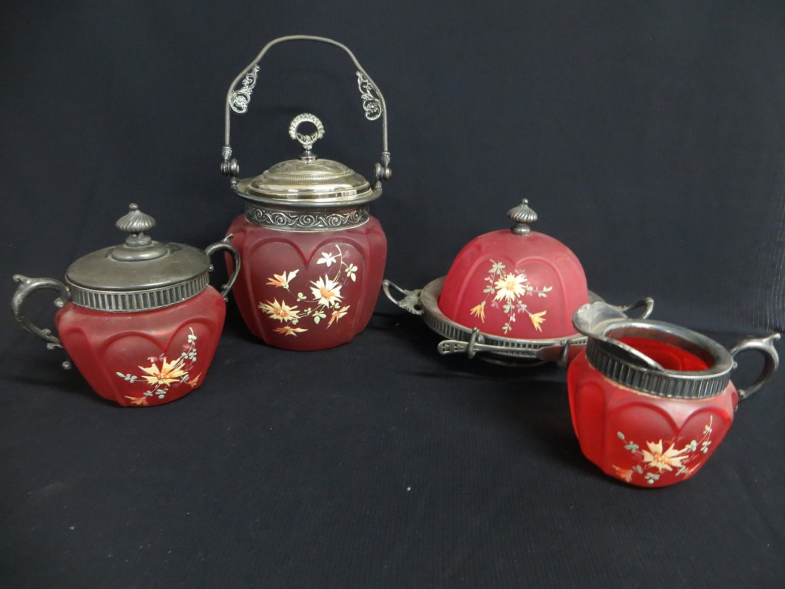 Matched set of Victorian red satin glass table articles: Matched set of Victorian red satin glass table articles, including sugar & creamer (silver plated lid), covered butter dish with silver plated lid, and a biscuit jar with silver plated lid and handle 