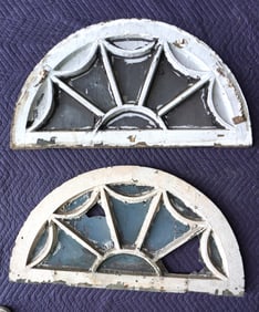 A pair of matching 1/2 round windows, 19th century, layers of old paint. One of the windows with 2