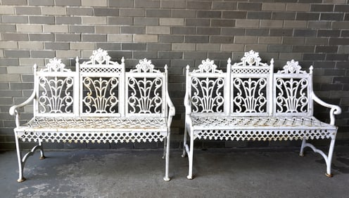 Pair of matching American Gothic cast iron garden settees with openwork seats, circa 1870-90. Each