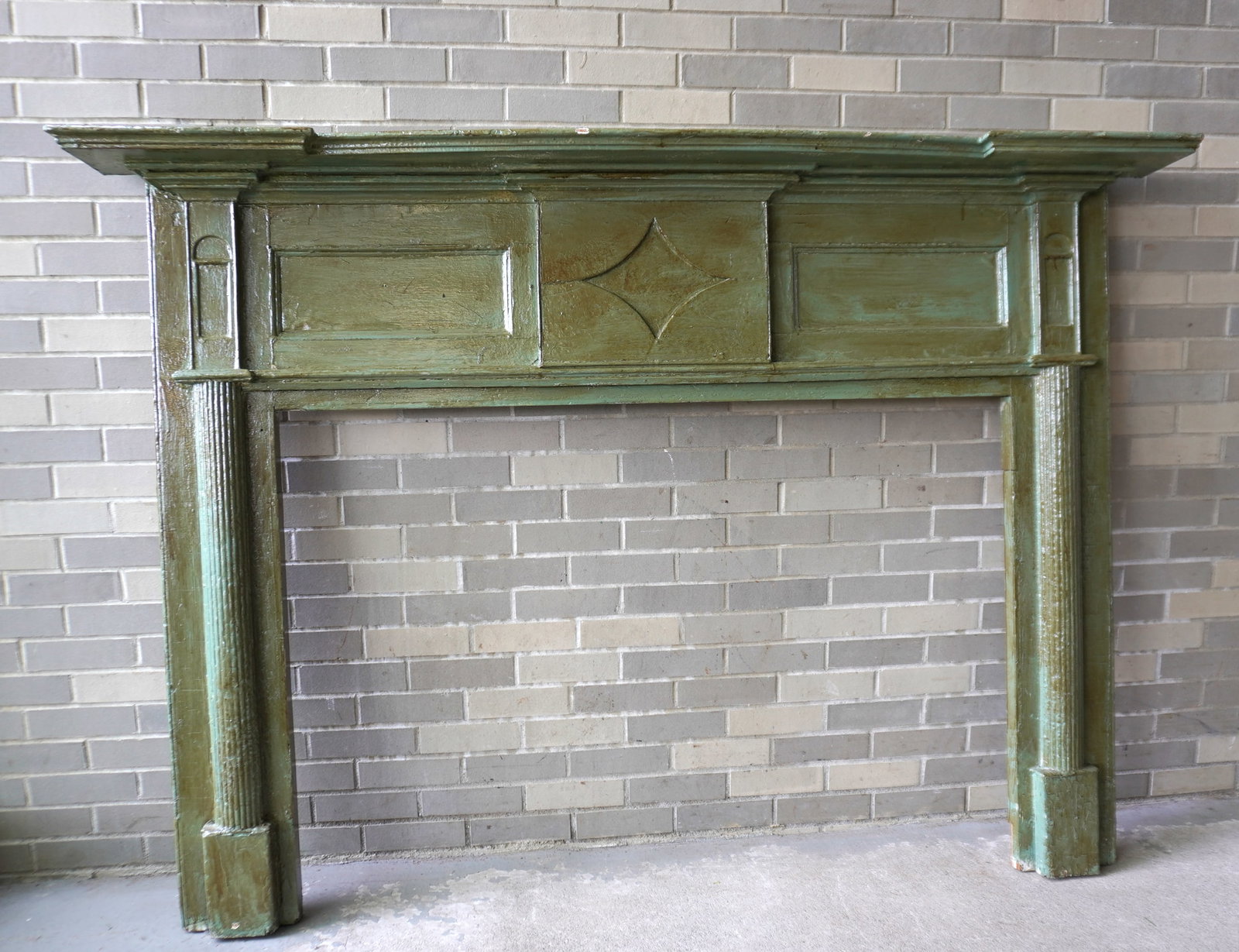Federal fireplace mantle with shaped shelf and reeded columns on legs, layers of old paint, overall: Federal fireplace mantle with shaped shelf and reeded columns on legs, layers of old paint, overall good condition, early to mid 19th century. Overall size 77"W x 9"D x 54 1/2"H - opening 53 3/4"W x 3