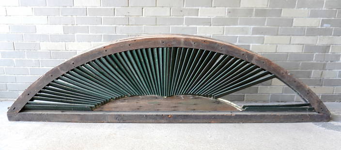 A very large architectural half round louvered window (vent), 19th century. Losses to louvers, else: A very large architectural half round louvered window (vent), 19th century. Losses to louvers, else fair to good condition. Measures 89"W x 10"D x 23"H. Provenance: From the Marni Bakst and William