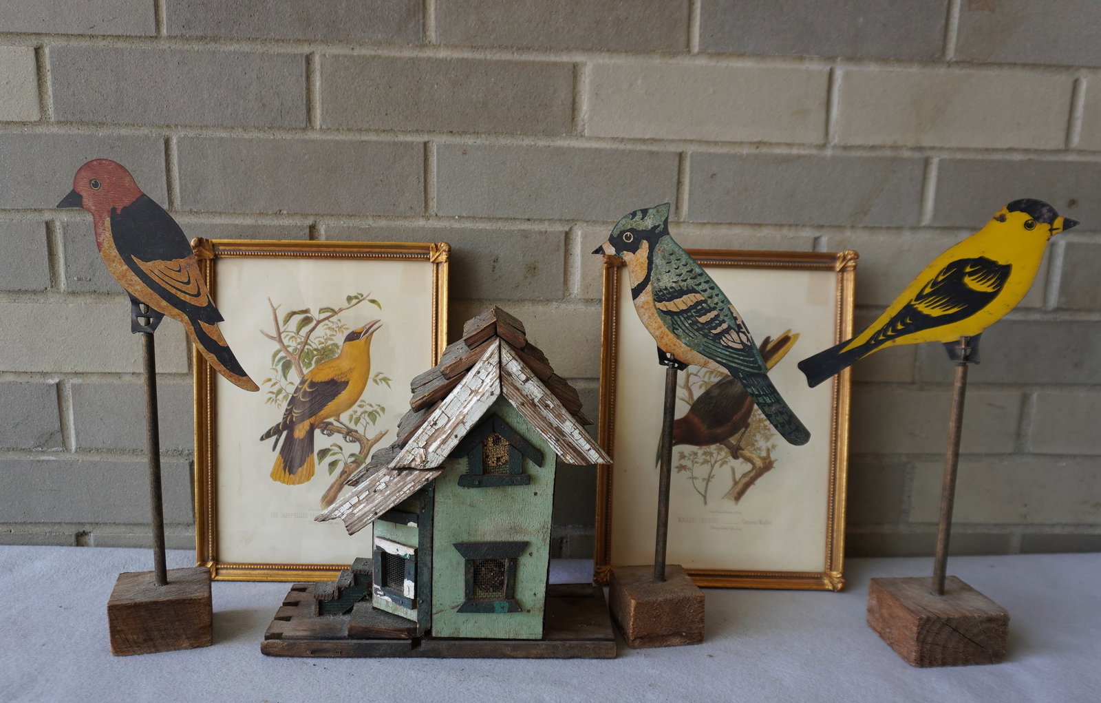 A grouping of song bird related collectibles including: A small custom made birdhouse, 20th century,: A grouping of song bird related collectibles including: A small custom made birdhouse, 20th century, constructed from old wooden furniture or architectural parts - measures 9 1/4"H - the base 9 1/2"W 
