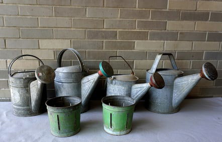 Grouping of 3 galvanized watering cans and 2 painted metal fruit (berry) display cans. The latter in