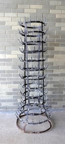 A large French bottle drying rack, galvanized metal, good condition. Measures 59"H x 15" diameter at