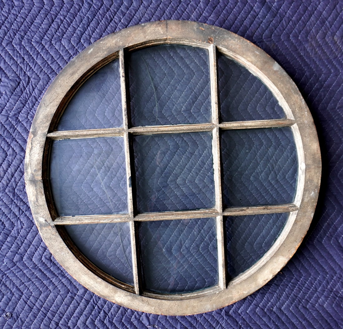 Round wooden window with 9 panes, late 19th to early 20th century. Was recently used as a wall: Round wooden window with 9 panes, late 19th to early 20th century. Was recently used as a wall decoration in a Clinton Corners NY estate. 30" diameter x 1 3/4" thick. Good condition.