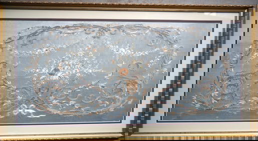 A very fine silk embroidery decorated with flowers on vines, and scrolls surrounding a central image
