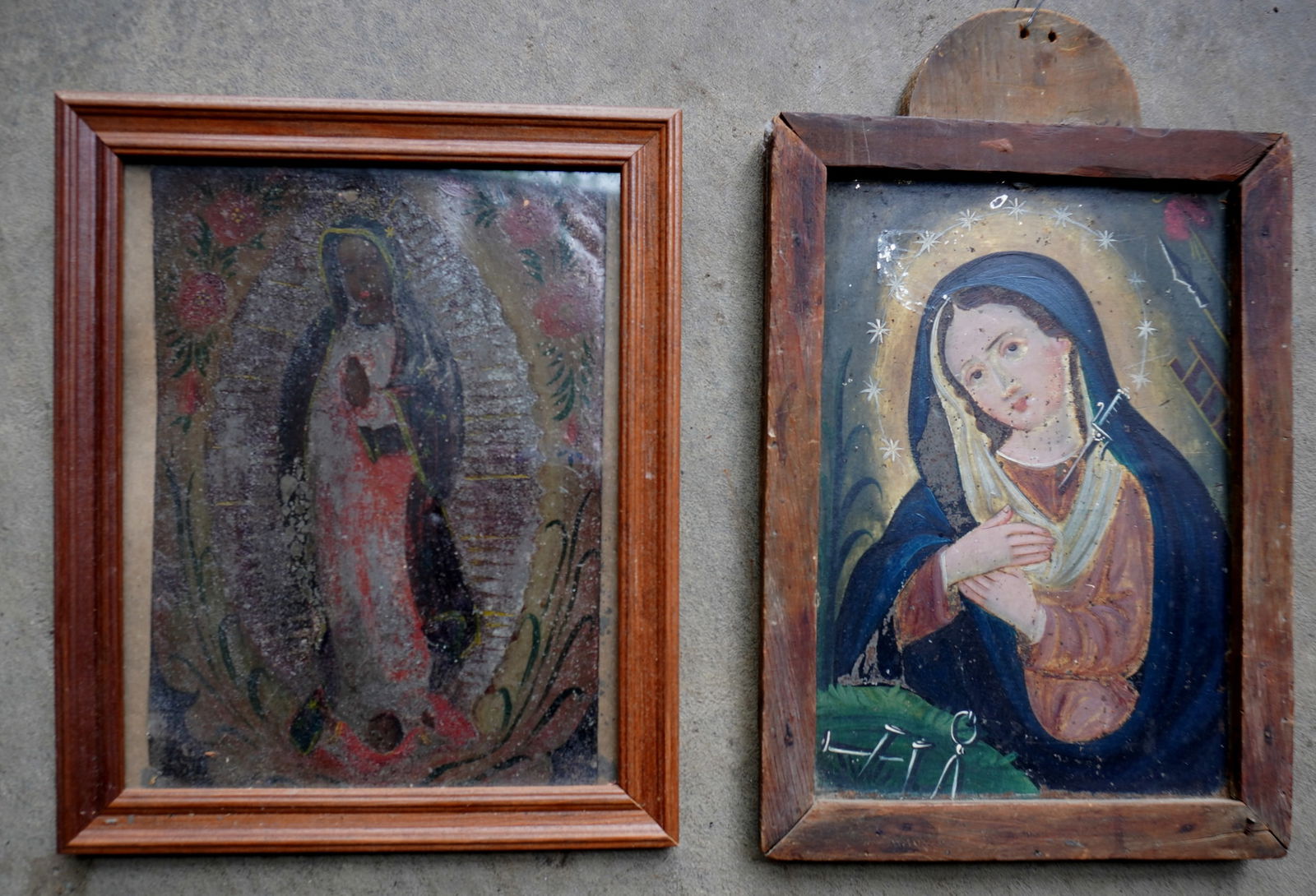 Two early folk art Spanish retalbo's on tin. The first of the Virgin Mary with dagger in heart, late: Two early folk art Spanish retalbo's on tin. The first of the Virgin Mary with dagger in heart, late 19th century - appears to be housed in original wooden frame - deceased owner's name incised into b