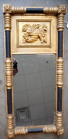 A good Sheraton wall mirror. The border with rosettes in each corner and turned half columns on all