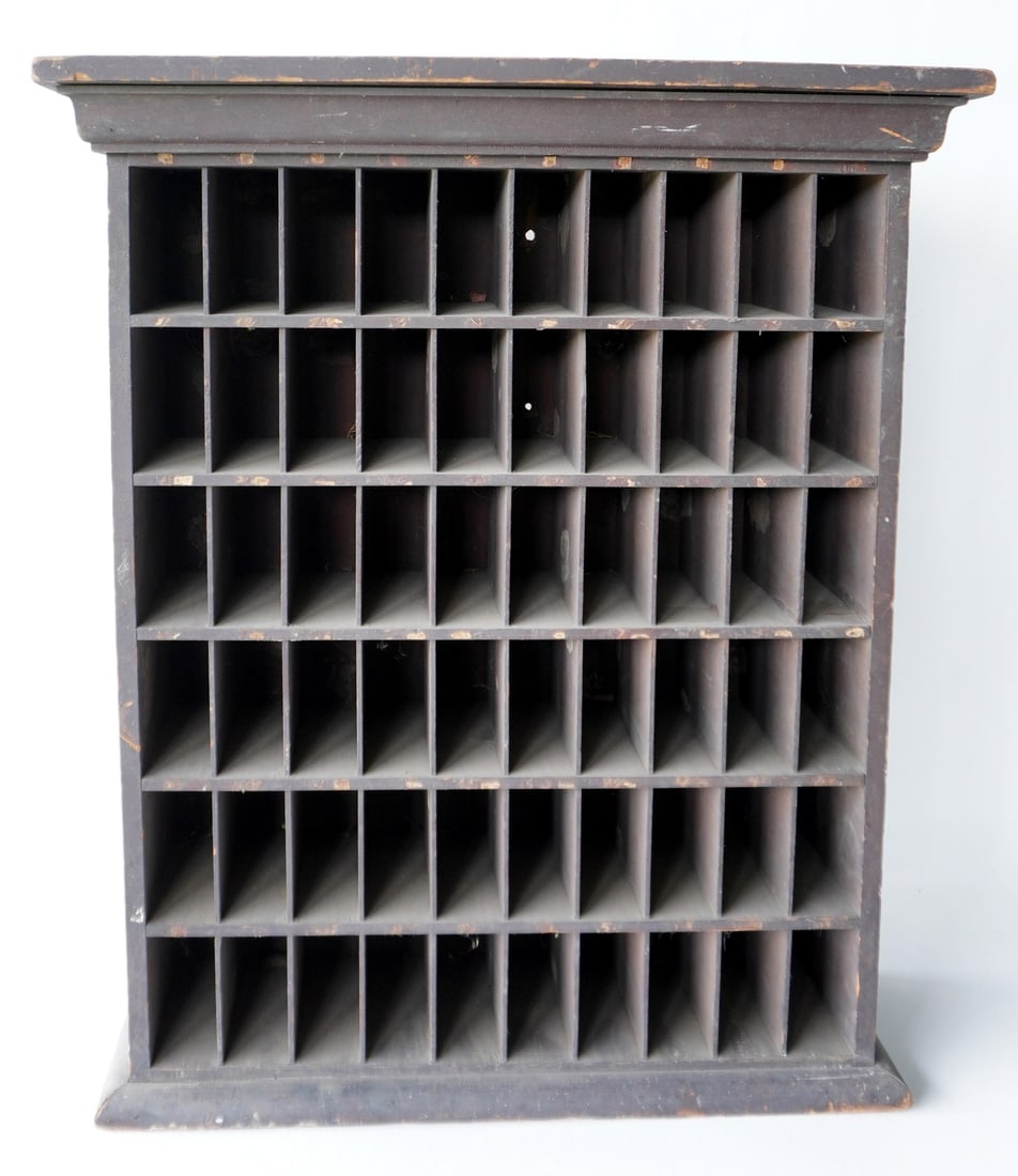 A cubby hole unit with 60 open slots, 19th century. Can be either hung on wall or used as a table: A cubby hole unit with 60 open slots, 19th century. Can be either hung on wall or used as a table top unit. Chip out of top rear edge, else good condition. Measures 8"D x 25"W x 29 3/4"H. Provenance: 