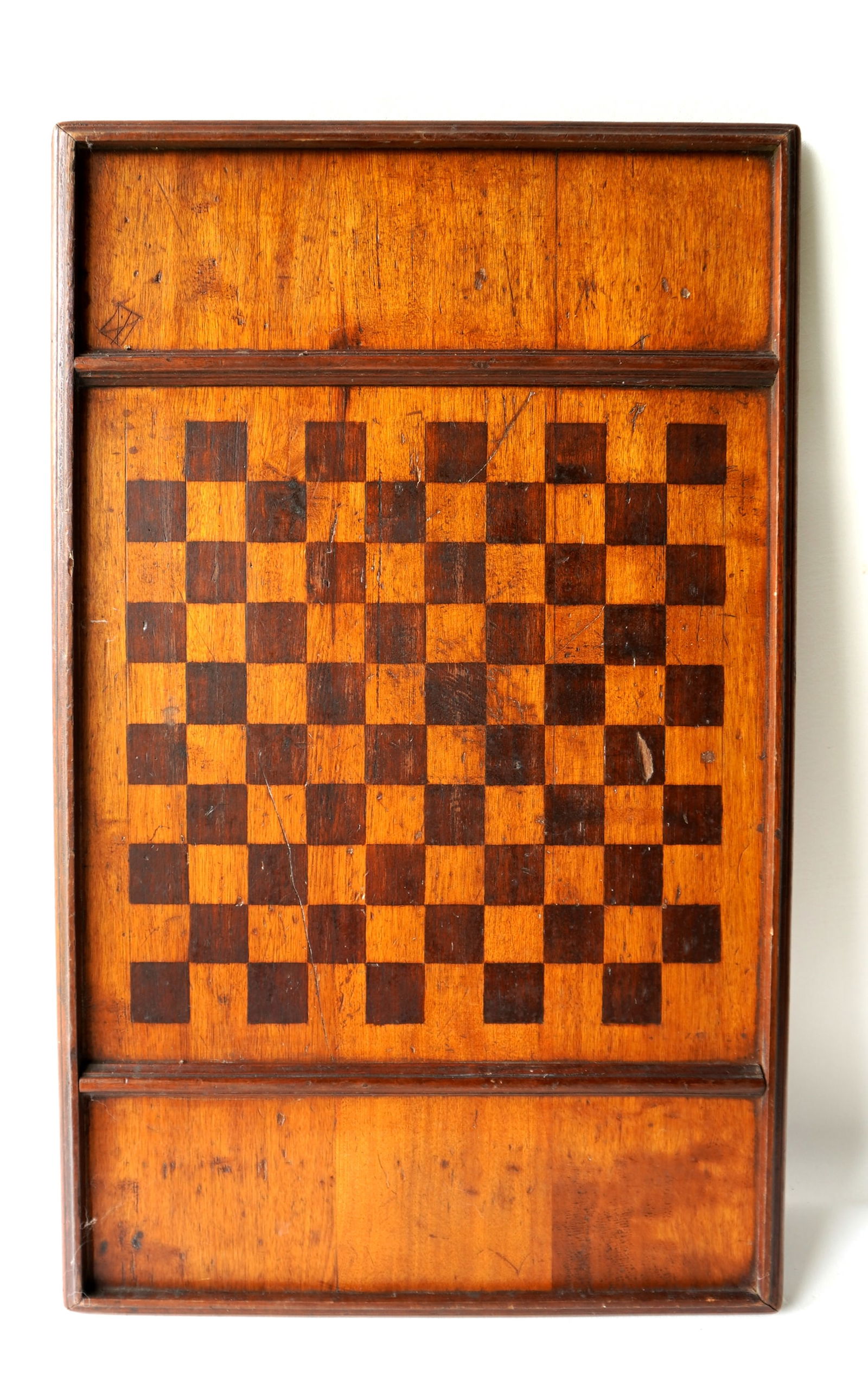A double side game board in original paint - brown squares and natural finish - original molded: A double side game board in original paint - brown squares and natural finish - original molded borders. Typical use wear and overall in very good condition. 19" x 30 1/2". Provenance: From the Marni
