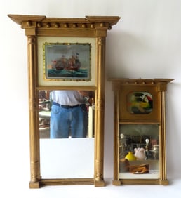 Two Sheraton double panel wall mirrors, circa 1820-30. The first with a reverse painting in upper