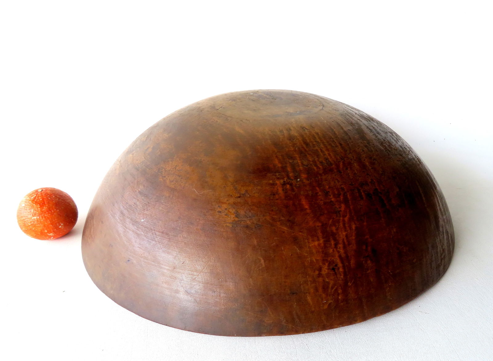 A tiger maple treenware bowl, mid 19th century, very good condition. Out of round as expected: A tiger maple treenware bowl, mid 19th century, very good condition. Out of round as expected measuring 20 1/2" x 21 1/4" x 6 1/2"H. Provenance: From an Ulster County NY resident, downsizing Americana