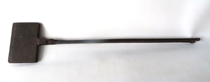A rare 18th century hand forged waffle iron with incised decorations including stars above a bird