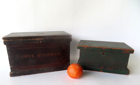 Two primitive hand made wooden document boxes in original paint. The first has oxidized to a dark