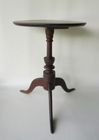 A good New England candlestand with round top, elaborately turned column having an urn over other