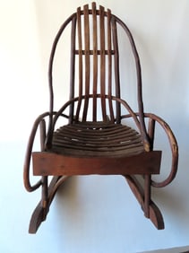 A child's Adirondack twig rocker with slats in seat and back, late 19th century in good original