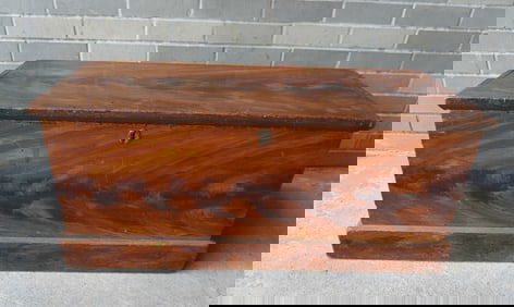 A red/black grain painted Hudson Valley blanket box with interior till and molded base, circa 1850.