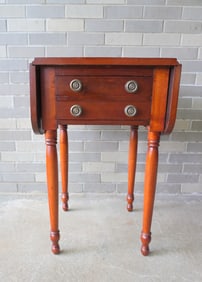 A refinished cherry Sheraton 2 drawer drop leaf sewing stand, early 19th century. Dovetailed drawers