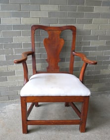 A period transitional Chippendale cherry armchair with scrolled arms and shaped back splat and