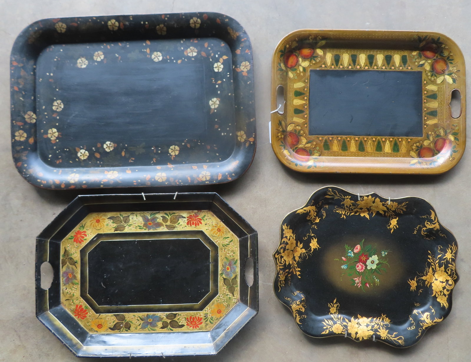 Grouping of 4 toleware hand painted trays, 19th century, all appear to be in original paint. The: Grouping of 4 toleware hand painted trays, 19th century, all appear to be in original paint. The largest measures 24 1/4" x 17 1/2". Provenance: From the June & Bernard Pierce estate, Hyde Park NY.