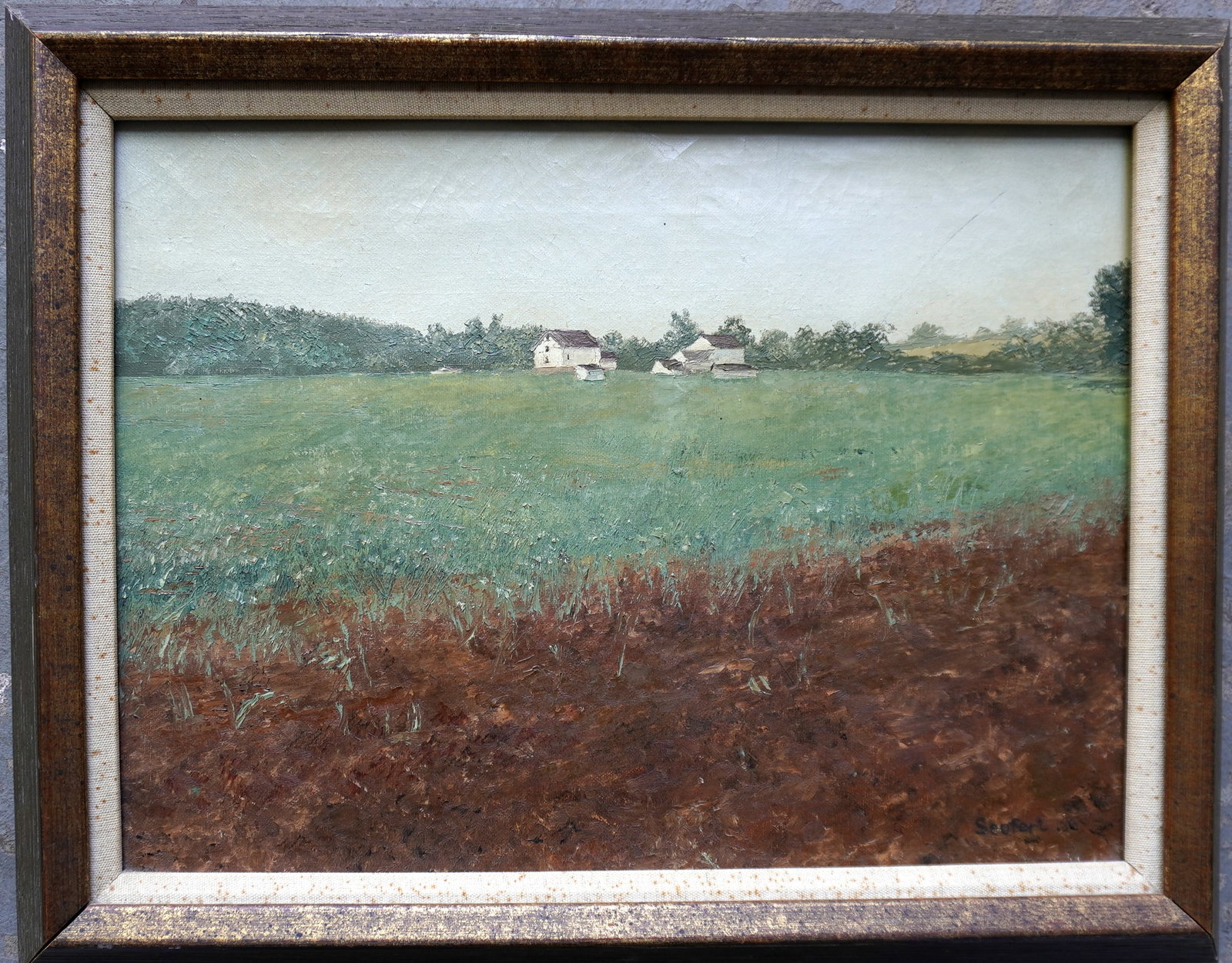 O/C Landscape with field with flowers in foreground and farmhouse with barns in background, signed: O/C Landscape with field with flowers in foreground and farmhouse with barns in background, signed Seufert lower right. Possibly Robert Seufert, Pa. Total frame size 15 1/4" x 19 1/4". Very good condi