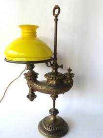 A brass or bronze Wild & Wessel adjustable student lamp, having a very ornate Aladdin style
