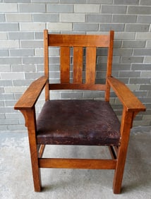 An original Gustav Stickley mission oak armchair #366 with original leather seat and having 3