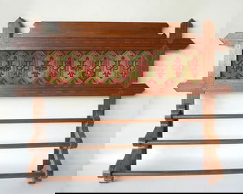A butternut Arts & Crafts towel rack, wall mounted, decorated with inlays and needlepoint tapestry.