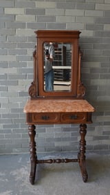 A Victorian black walnut marble top dressing table with attached mirror over rose marble with