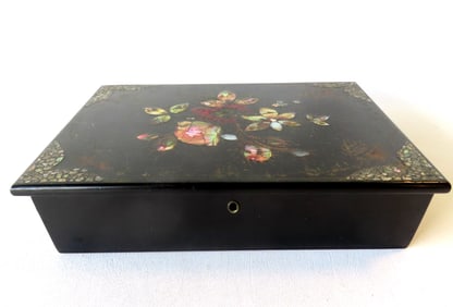 A black lacquered paper mache lap desk with interior velvet writing surface - the box decorated with