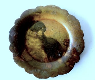A paper mache hand painted portrait plate of 2 dogs, the larger dog at rest and the smaller younger