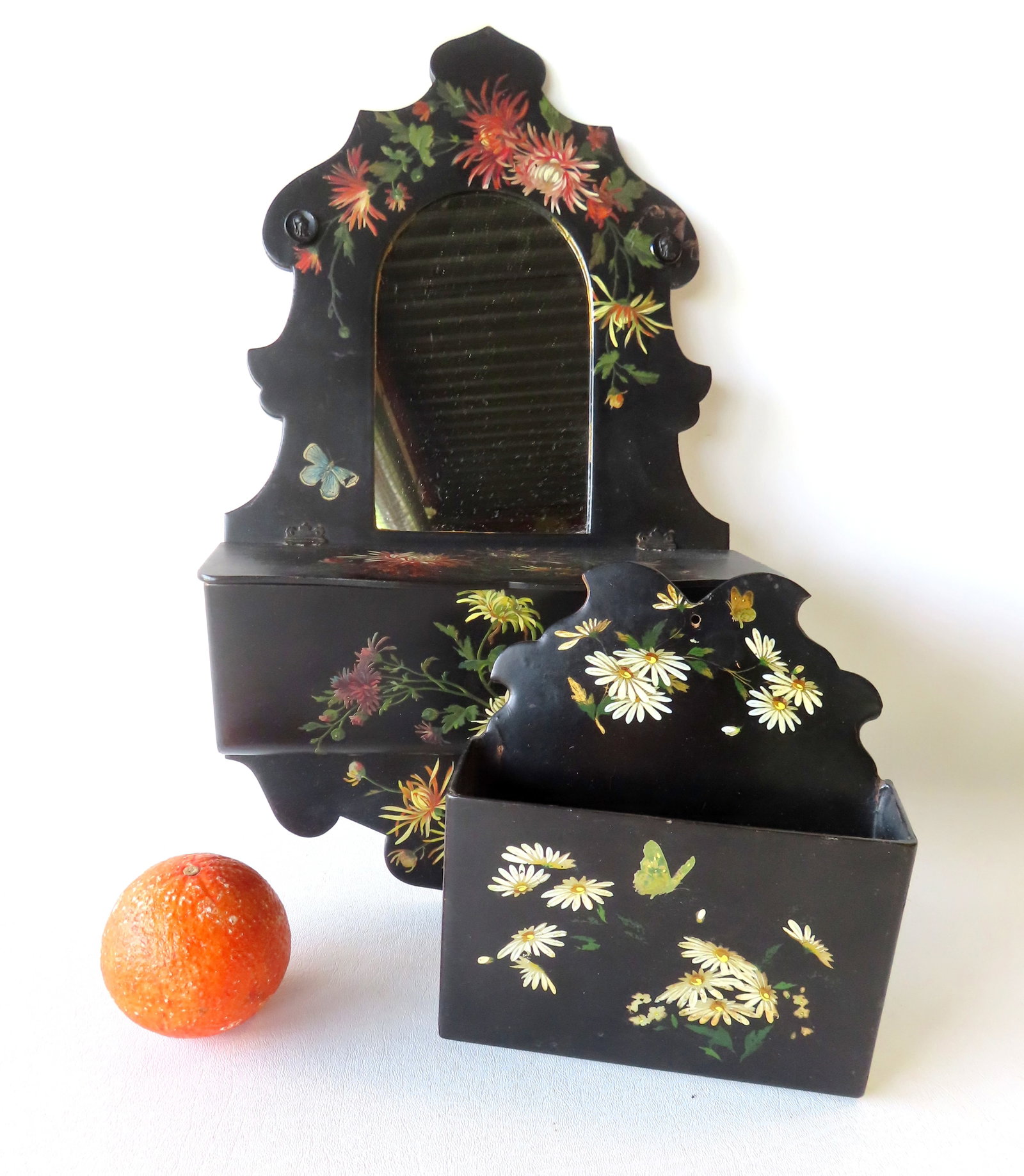Two Victorian very fine paper mache wall boxes, 19th century. The first, with mirror on upper panel: Two Victorian very fine paper mache wall boxes, 19th century. The first, with mirror on upper panel above lid over storage area - the unit decorated with hand painted flowers. Note the 2 small figural