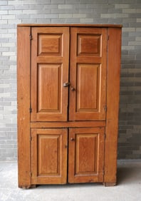 A Hudson Valley 4 door pine cupboard, with 2 paneled doors over 2 paneled door, interior paint is