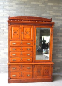 A large birch side-by-side bookcase cupboard in 2 sections. The top section with shaped and chip