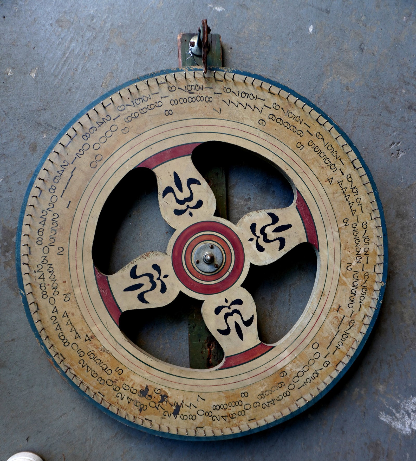 A vintage hand made carnival gaming wheel in original paint, early to mid 20th century. Some typical: A vintage hand made carnival gaming wheel in original paint, early to mid 20th century. Some typical use wear, and overall in very good condition in working order. Measures 30 1/4" diameter x 4" deep 
