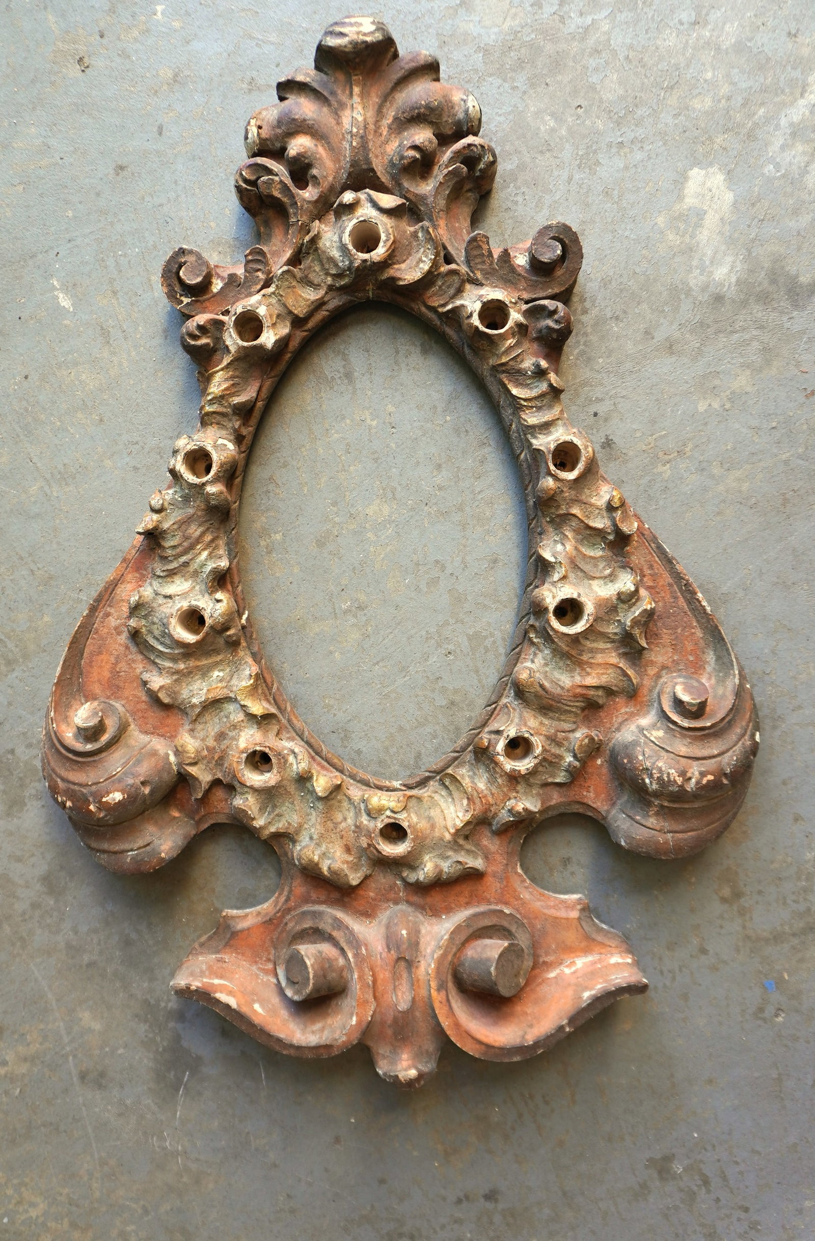 A rare carved wooden carnival picture frame, classical carnival design, likely for holding portrait: A rare carved wooden carnival picture frame, classical carnival design, likely for holding portrait of wild animal or circus performer - note the holes around the perimeter of frame for insertion of l