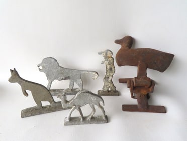Five cast iron shooting targets. The first a mechanical duck - lacking paint and some surface rust