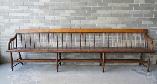 A long country spindle back meeting house bench, old finish, plank seat, traces of old green paint,
