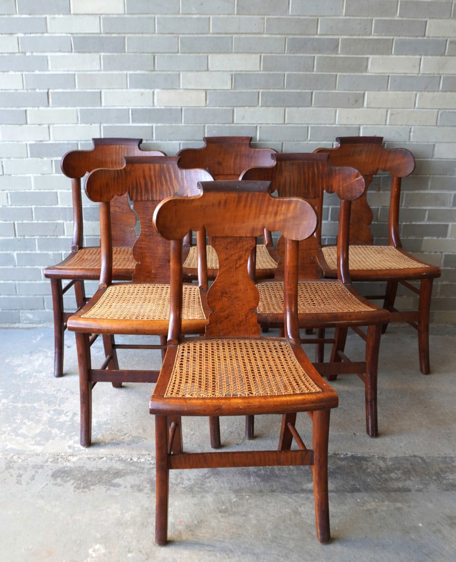 Set of 6 Sheraton tiger & birdseye maple dining chairs with woven cane seats and saber legs, circa: Set of 6 Sheraton tiger & birdseye maple dining chairs with woven cane seats and saber legs, circa 1830-50. Three of the chairs with hairline on base of back splat hardly noticeable, one chair with sl