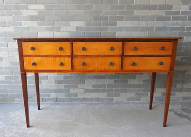 A signed Eldred Wheeler sideboard in cherry with 6 tiger maple drawers and tapered legs, hand