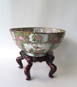 A Chinese export rose medallion porcelain punch bowl decorated with medallions of oriental figures,