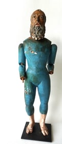 A large carved wooden Santos doll with articulated arms, glass eyes and in original paint, 18th