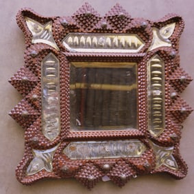 An unusual tramp art wall mirror - the central beveled mirror is surrounded by smaller decorative