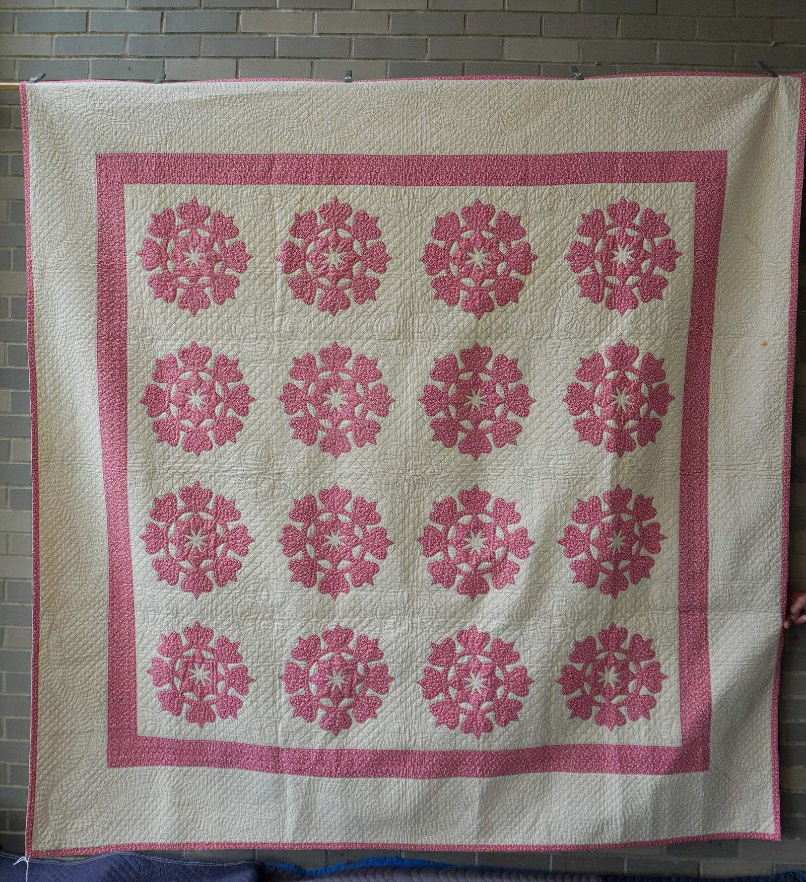 A very fine applique quilt, flowers surrounding stars pattern, all hand sewn with very fine quilting: A very fine applique quilt, flowers surrounding stars pattern, all hand sewn with very fine quilting in near excellent condition, probably mid 19th century. Note the original penciled pattern marks st