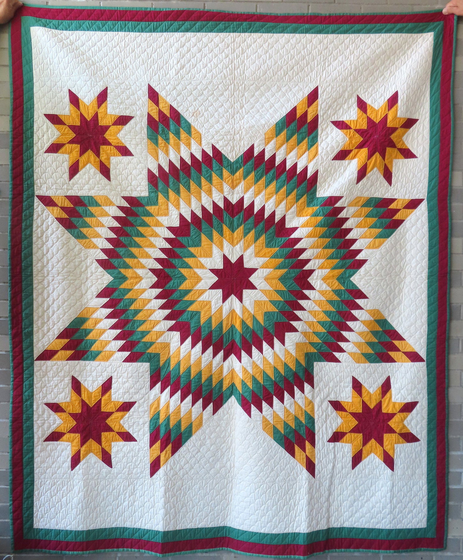 A patchwork quilt in the "Bethlehem Star" pattern, excellent condition, all hand sewn with very fine: A patchwork quilt in the "Bethlehem Star" pattern, excellent condition, all hand sewn with very fine quilting, late 19th to early 20th century. Measures 70" x 86".