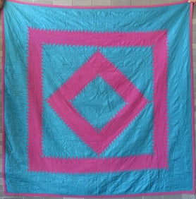 An Amish quilt, Diamond In a Square" pattern, probably Lancaster County Pa., very tight stitches of