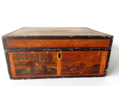 An early document box having a lid decorated with many hand painted concentric rectangles to